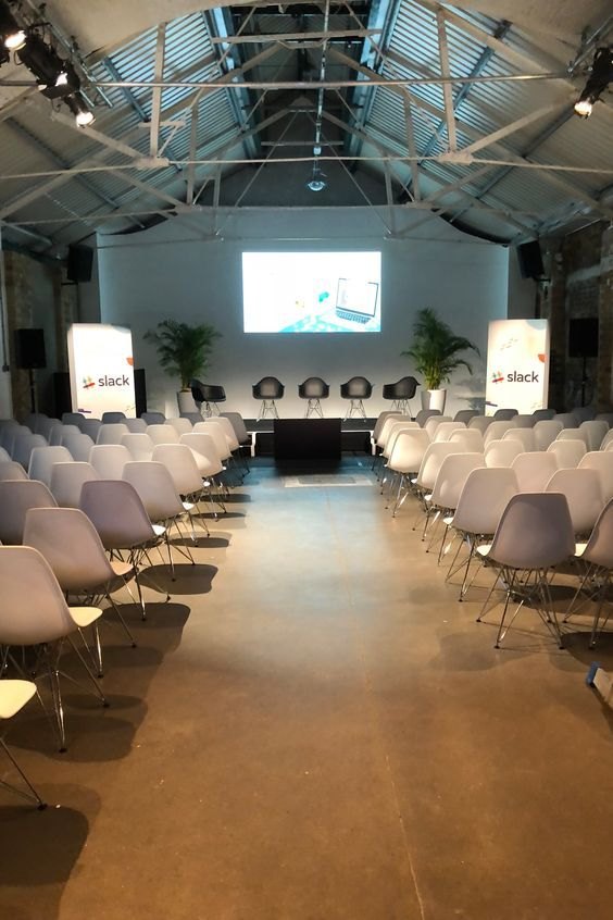 Attendees seated at an evening community event in the VoltCafé event space