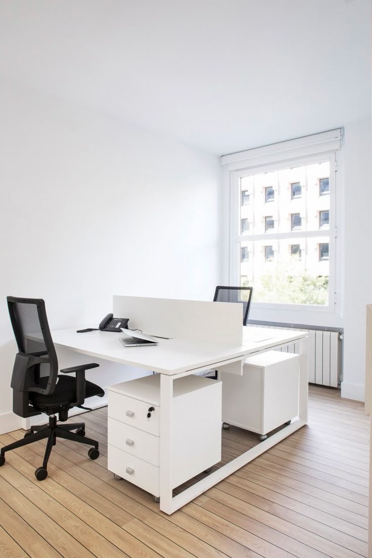 An enclosed private office at VoltCafé set up for a team of four
